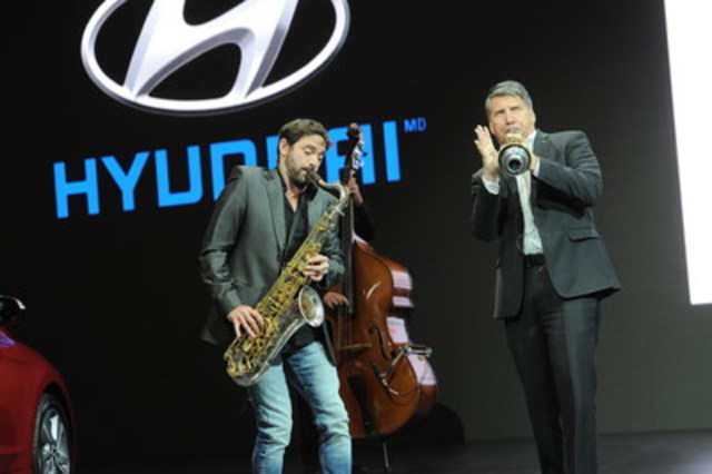 Hyundai spokesperson in Quebec, Guillaume Lemay-Thivierge, and Don Romano, President and CEO of Hyundai Auto Canada Corp. play some jazz at the Montreal Auto Show to celebrate Hyundai’s sponsorship of the Festival International de Jazz de Montreal. (CNW Group/Hyundai Auto Canada Corp.)